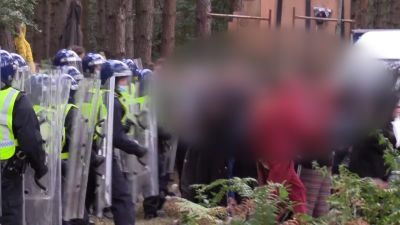 Police footage of illegal rave in Thetford Forest, blurred.