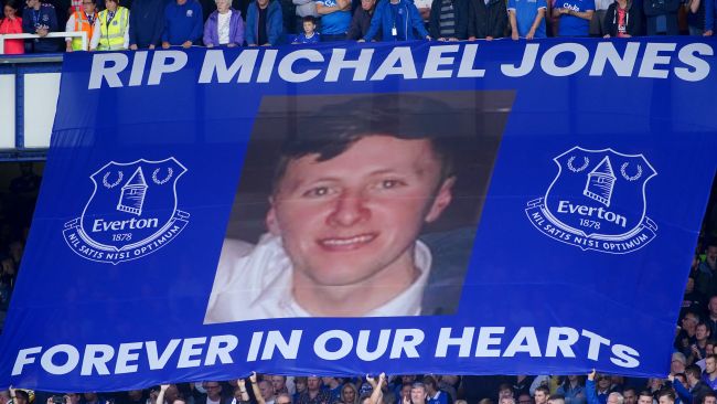 Large flag held up by crowd of Everton fans 