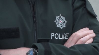 PSNI logo uniform Policing Police Officer Northern Ireland stock image still photo 
Credit: UTV 