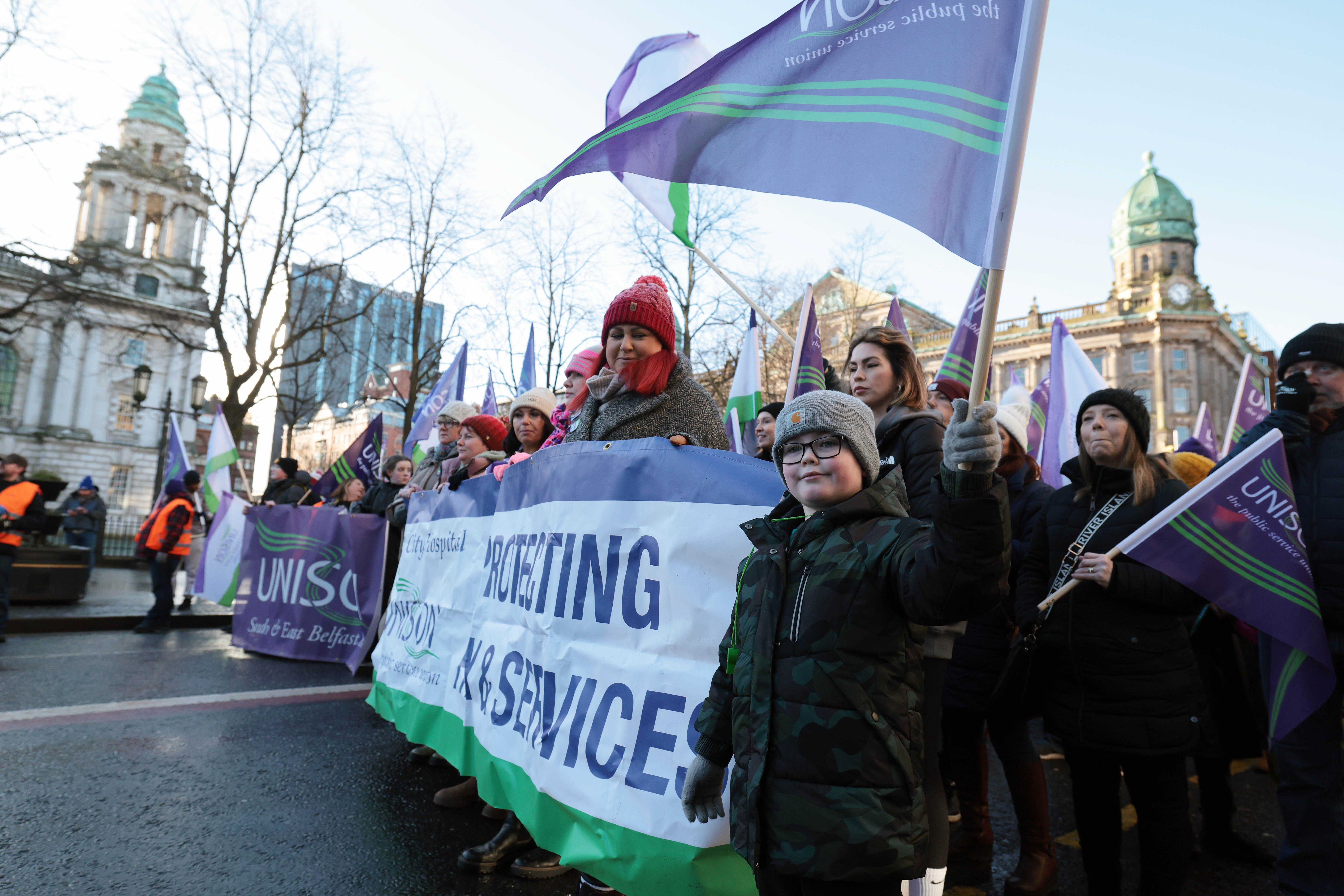 Unions arrive at City Hall rally as 'unprecedented' walkout in Northern ...