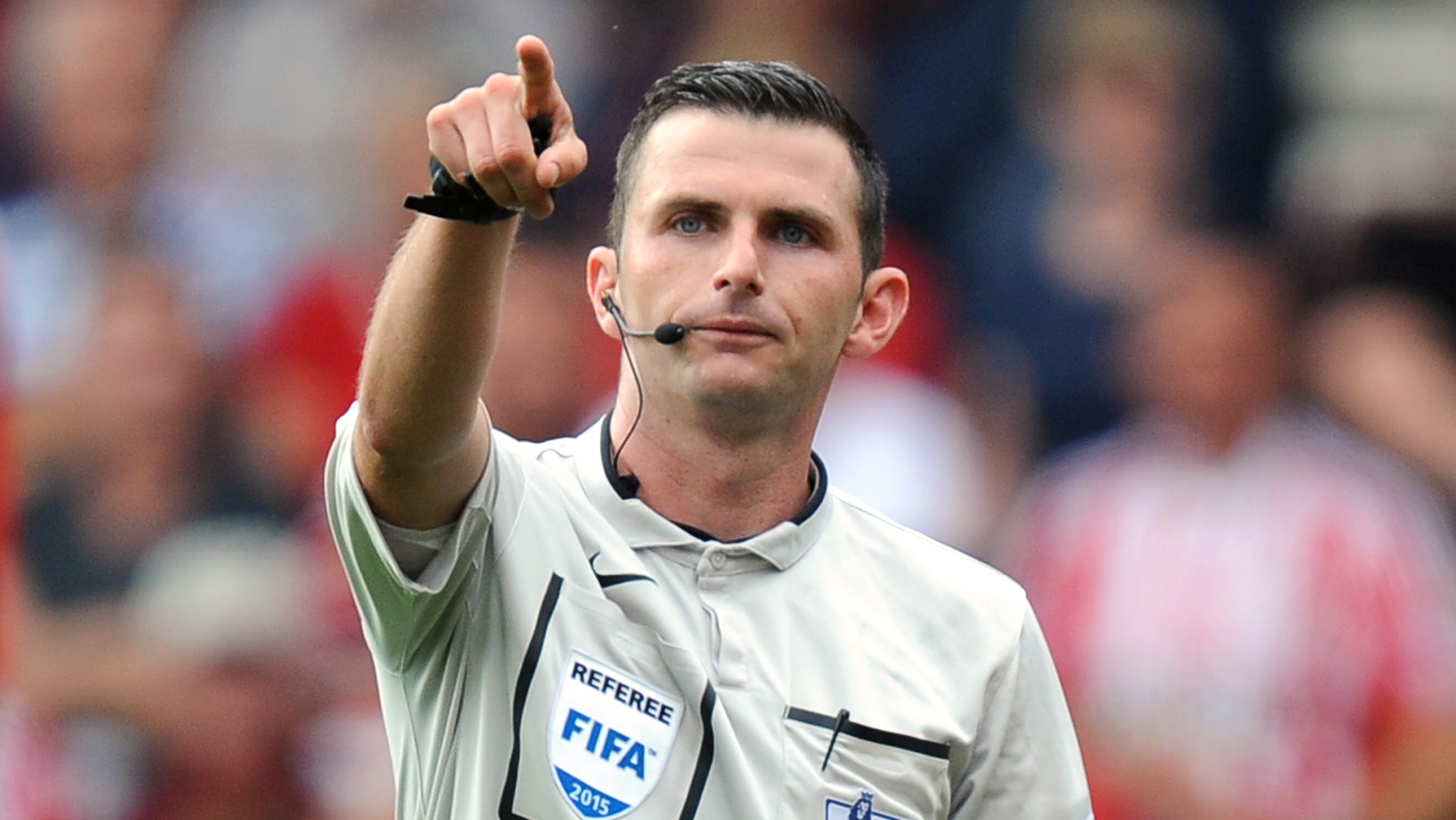 Premier League referee Michael Oliver runs line at women's match after 