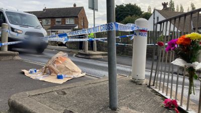 the scene outside North Huddersfield Trust School where a boy was stabbed