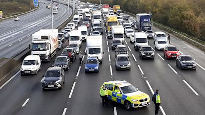 Police close a section of the M25 after Just Stop Oil protestors stage a protest in November 2022.