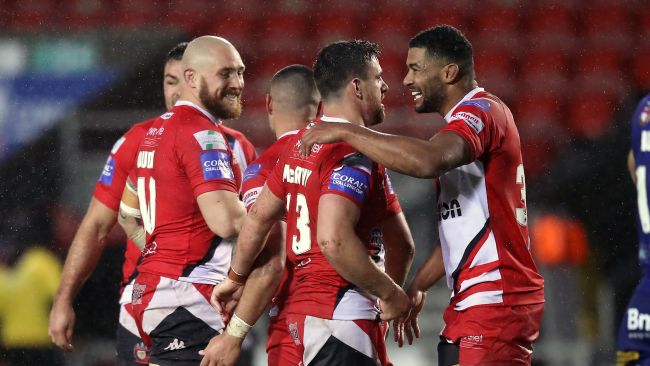 Salford Red Devils players celebrate Challenge Cup semi-final win