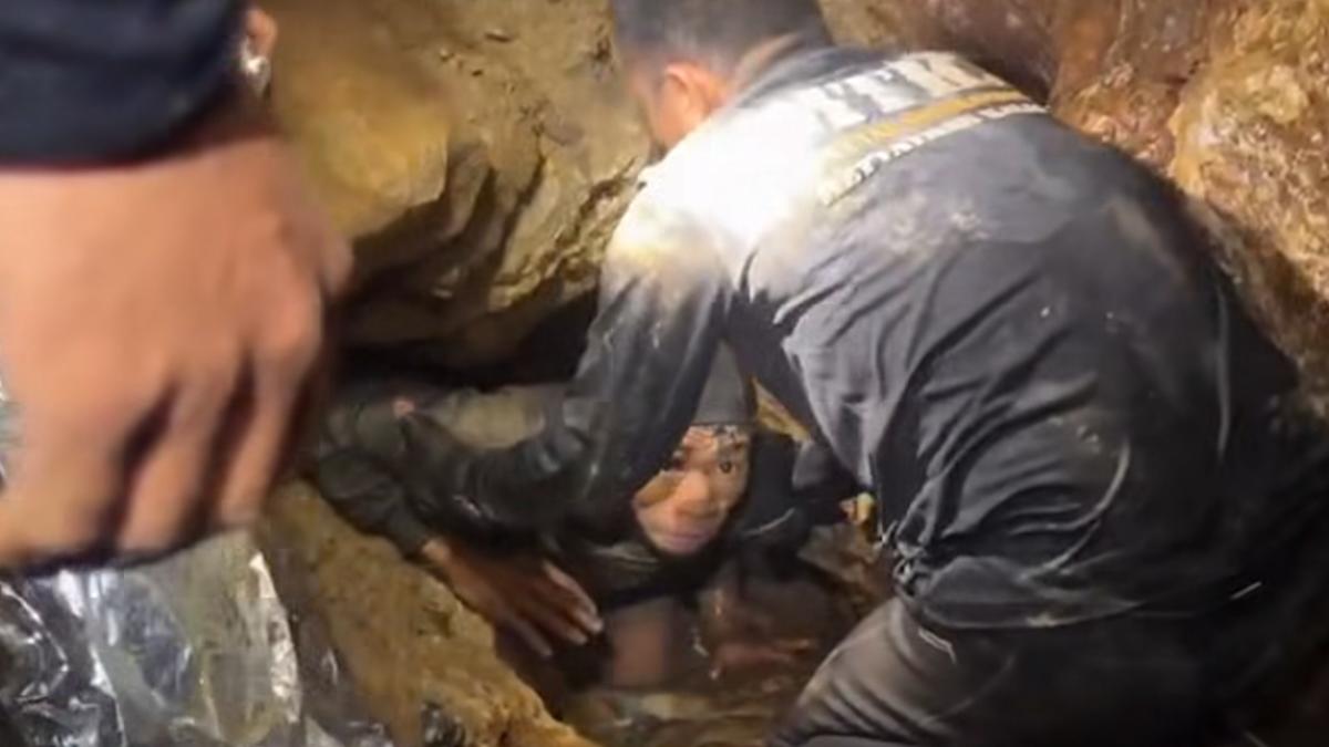 Four men rescued from flooded Laos cave as search continues for two ...