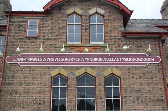 Llanfairpwll train station and sign.