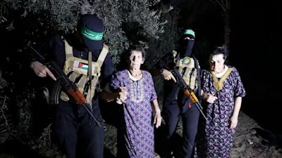 Freed hostages' 'emotional reunion' with family as Israel launches 400 airstrikes into Gaza | ITV News