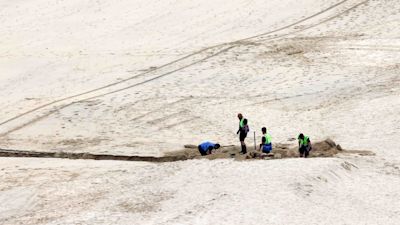 Workers building the bridge on Carbis Bay Beach