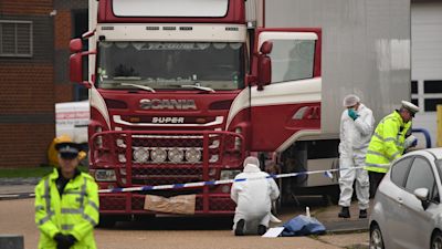 File photo dated 23/10/19 of police and forensic officers at the Waterglade Industrial Park in Grays, Essex, after 39 bodies of Vietnamese migrants were found inside the lorry on the industrial estate. Four people-smugglers could be facing life sentences for the manslaughter of 39 migrants who died in the back of a trailer.