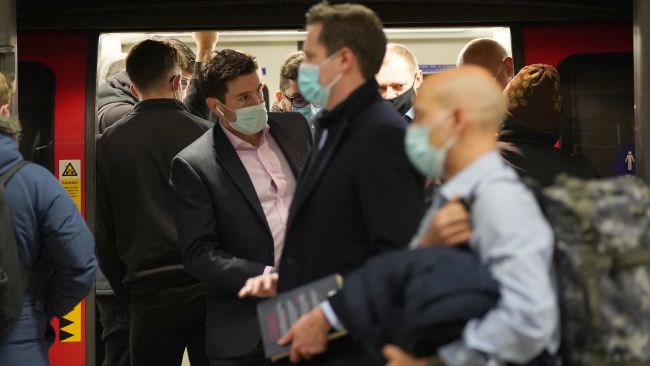 People wearing masks travelling on the London Underground, as mask wearing on public transport…