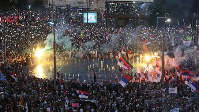 People wave their mobile phones with flashing lights during a major anti-government rally in Belgrade.