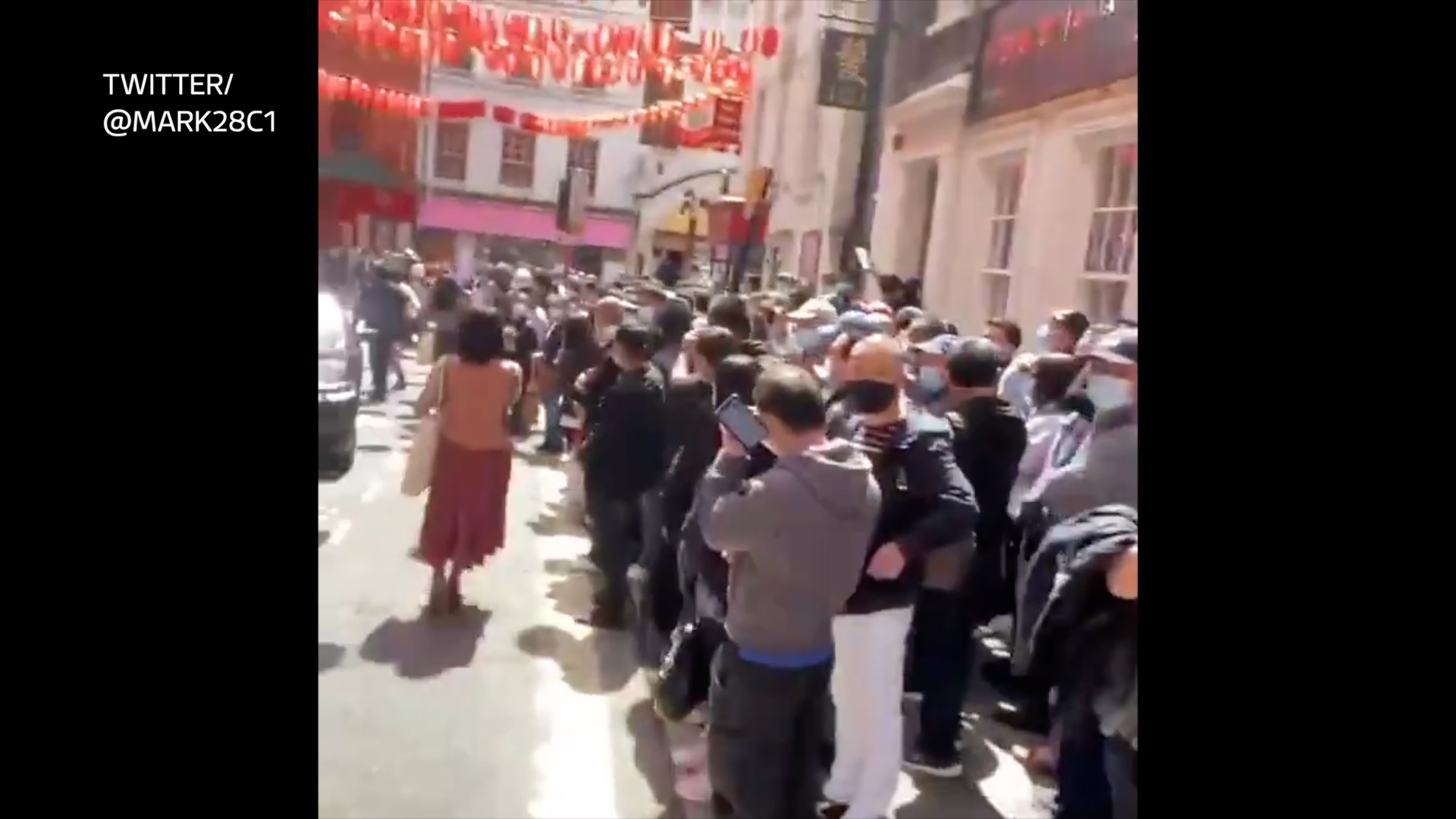 Huge crowd packs into London's Chinatown for 'no questions asked' jab