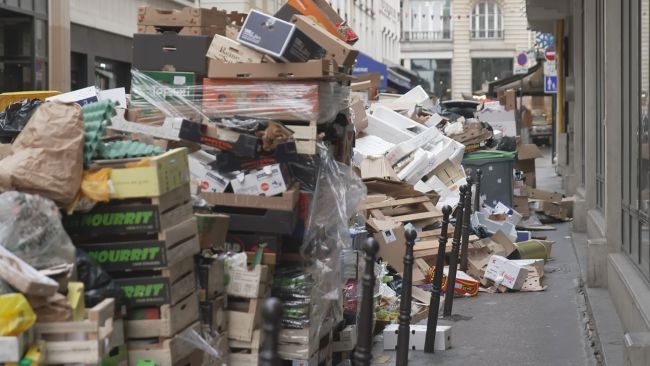 Rubbish piles up in streets and tear gas fired as French protesters clash  with police | ITV News