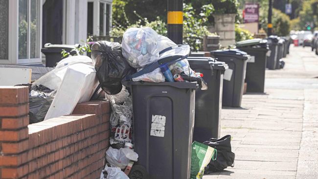 Rubbish flows over from bins outside homes in Birmingham