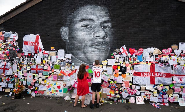 Defaced UK soccer star mural transformed into symbol of anti