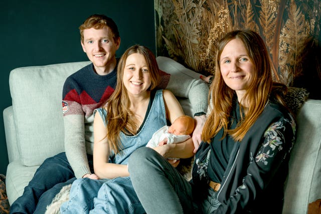 From left, Angus and Grace Davidson, holding baby Amy, and Grace's sister Amy