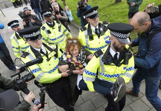 A protestor is carried away by police at a Palestine Action demonstration in Liverpool dqxikeidqkikdinv