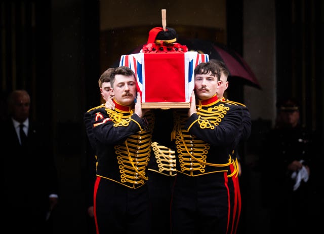 The coffin of Lance Bombardier Ciara Sullivan is carried from the Guards' Chapel, Wellington Barracks in central London