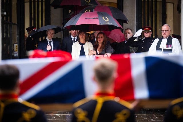 Family and friends watch as the coffin of Lance Bombardier Ciara Sullivan is carried from the Guards' Chapel, Wellington Barracks in central London 