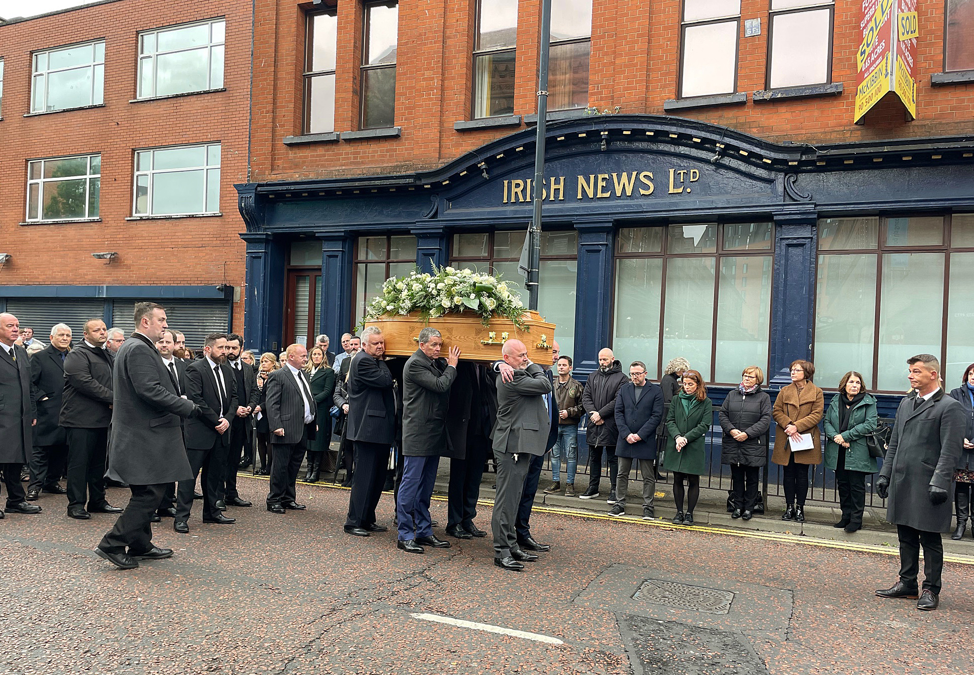 Funeral for Olympic icon and Irish News photographer Hugh Russell held
