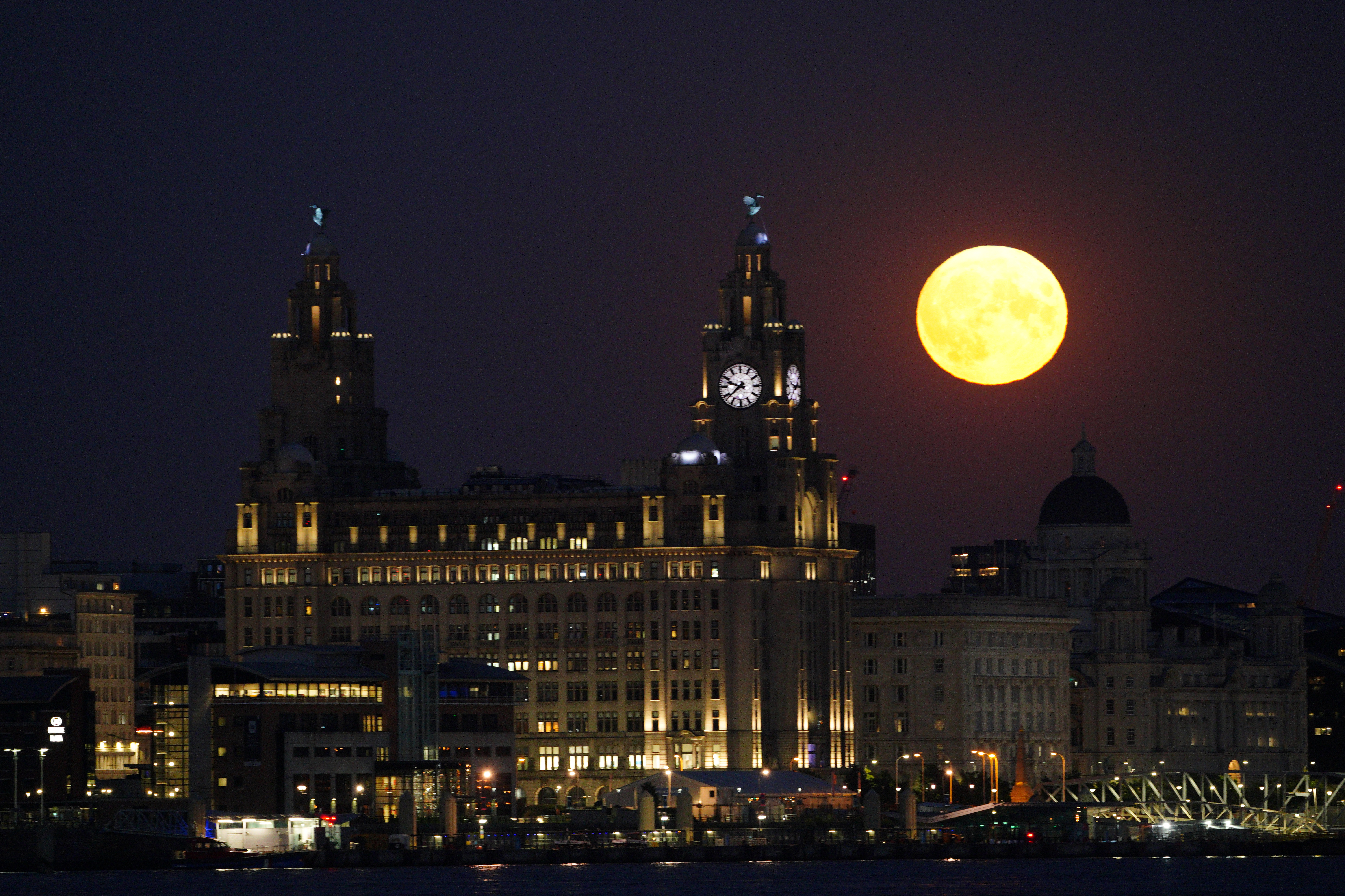 In Pictures: Spectacular supermoon lights up the night sky | ITV News