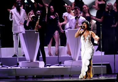 Raye makes Brit Awards history with six gongs