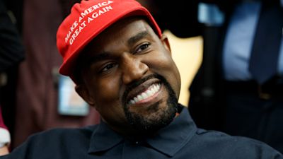 Kanye West in a Make America Great Again cap