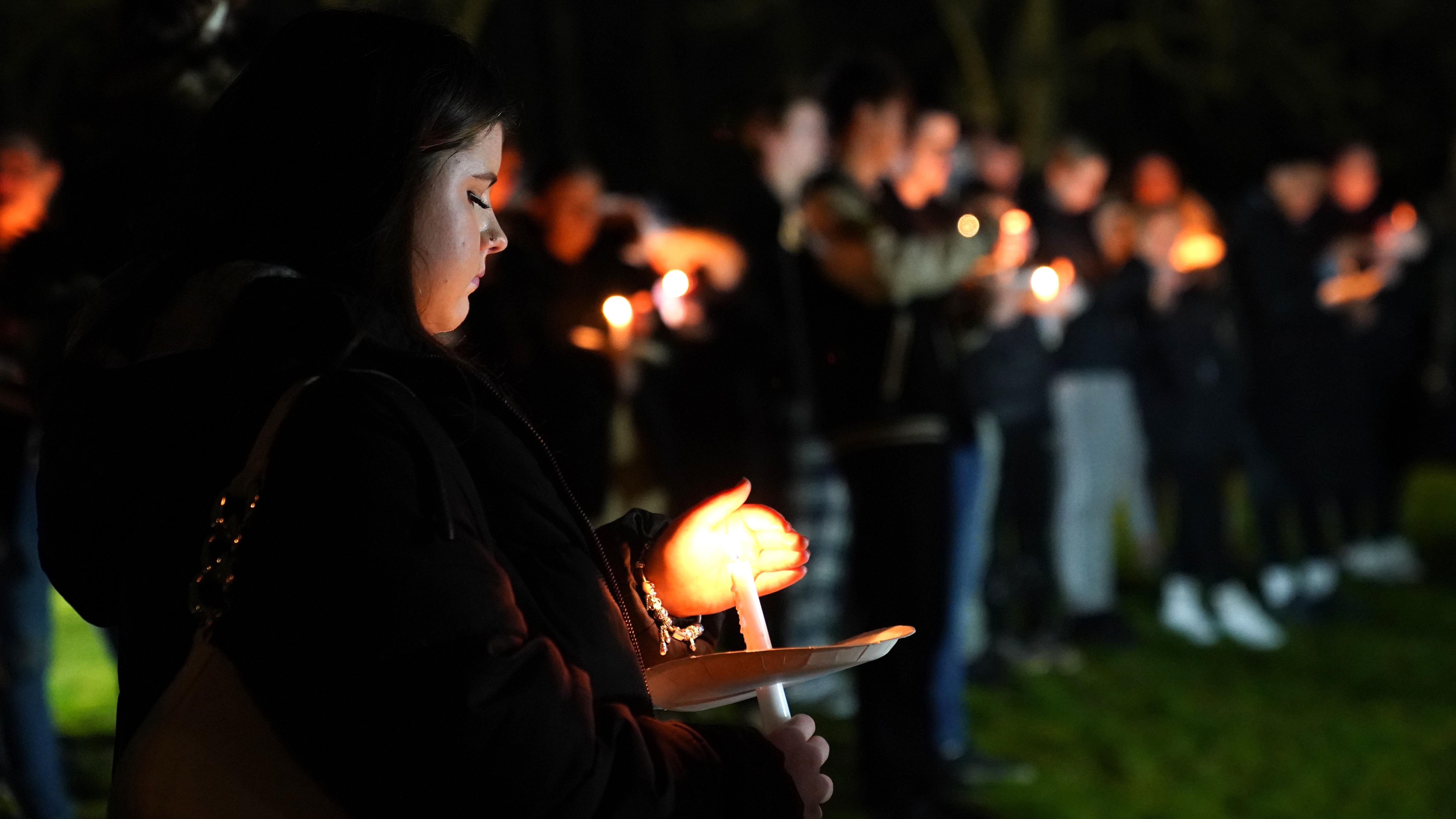 Candlelit vigil held for girl, four, who was mauled to death by pet dog ...