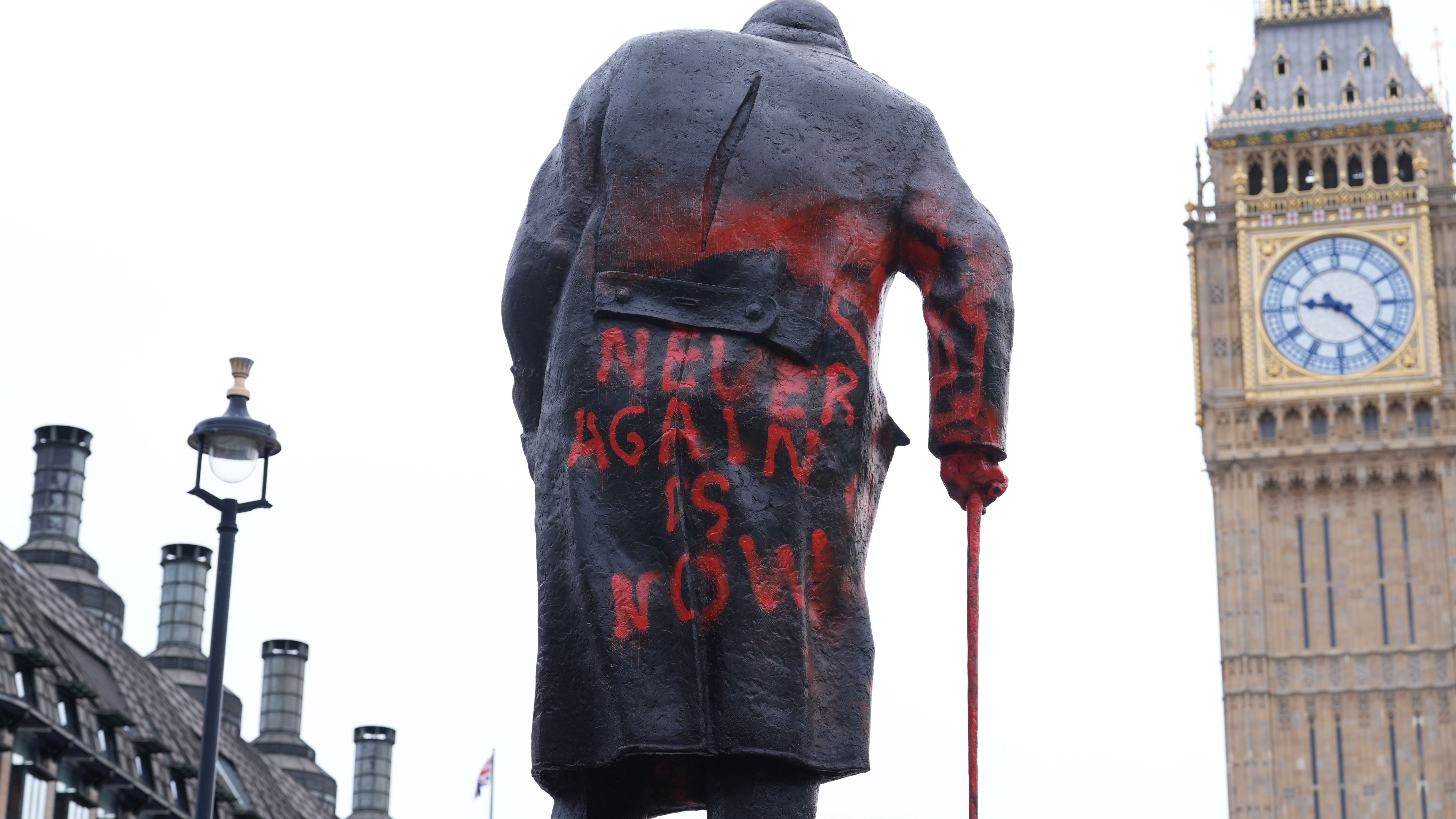 Man arrested after Winston Churchill statue daubed with graffiti calling ...