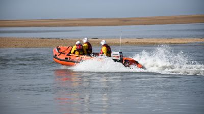 The Wells inshore lifeboat was called to rescue a group of dog walkers.