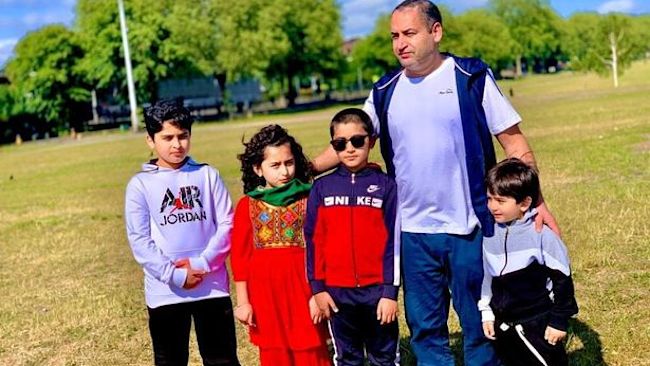 Raghib Ziahe, 48, pictured with his children. Asma, now nine, and Omar, now five.