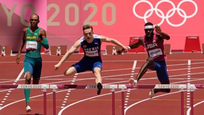 Karsten Warholm, of Norway, center, clears a hurdle before winning the gold medal ahead of Rai Benjamin, of United States in the final of the men's 400-meter hurdles at the 2020 Summer Olympics, Tuesday, Aug. 3, 2021, in Tokyo, Japan. At left is Alison Dos Santos, of Brazil who took the bronze. (AP Photo/Charlie Riedel)