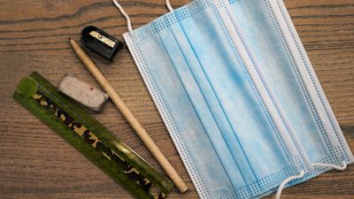 10/02/22. PA stockshot of a face mask with school stationary. PA Images