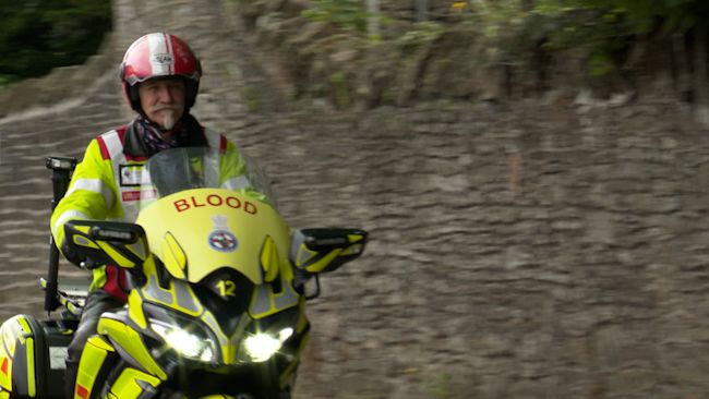 Rider on a motorcycle for the Freewheelers blood courier service