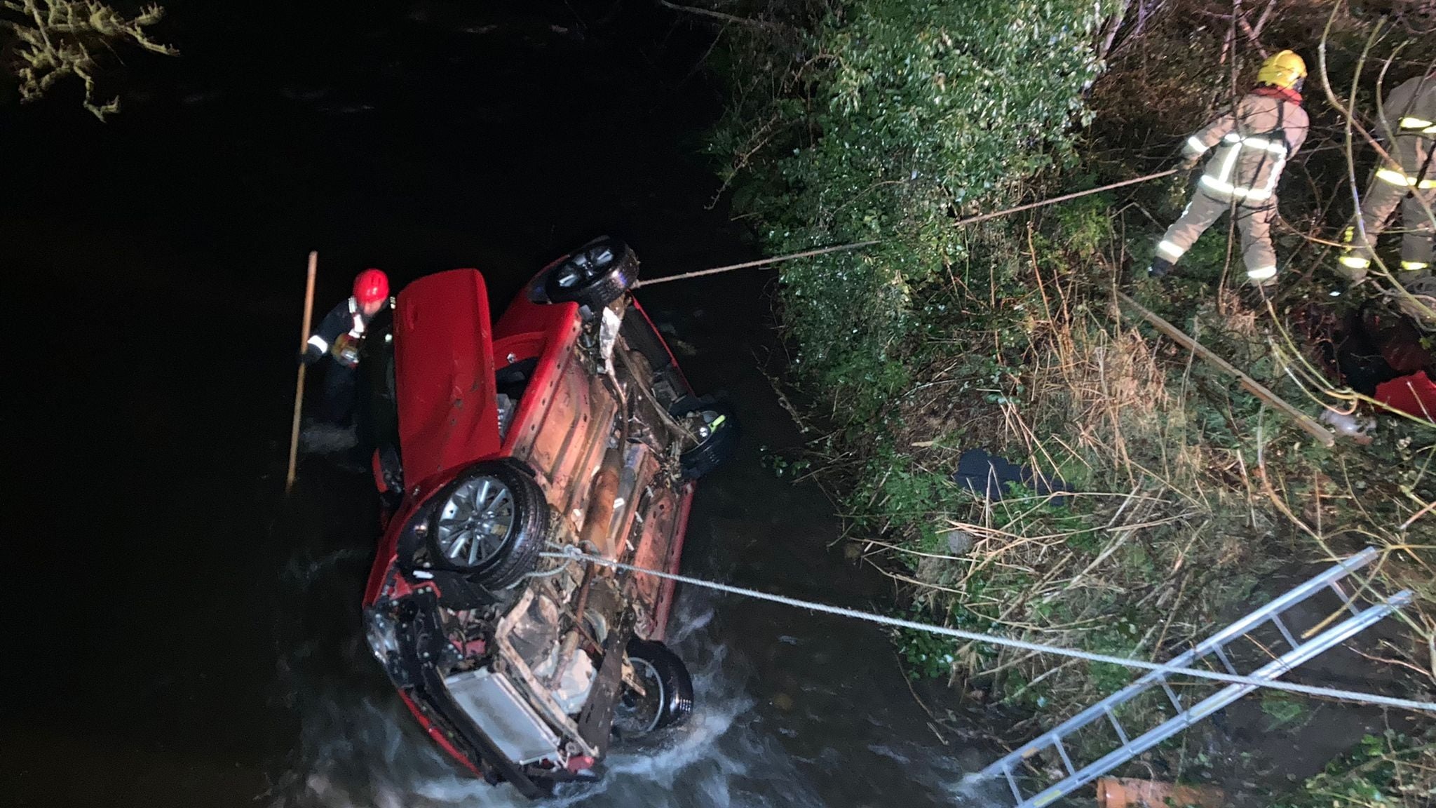 Two people rescued from river after car plunges into water on outskirts ...