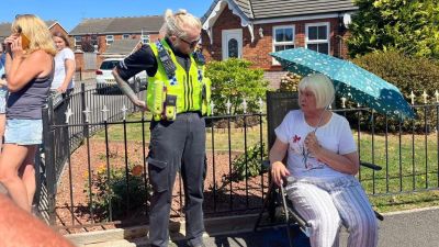 Dot Bolton speaks to police outside her home in Hull