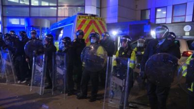 Police officers attended the protest with riot shields because of violence that broke out