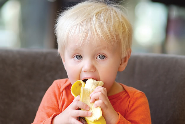 Toddler-boy-eating-banana