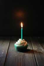 Birthday cupcake in darkness