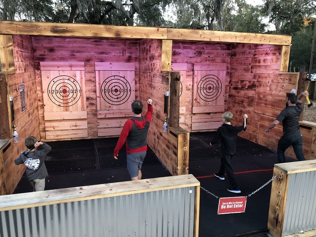 People throwing axes