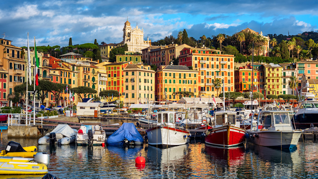 Some boats moored in Santa Margherita harbor and the typical houses in the background