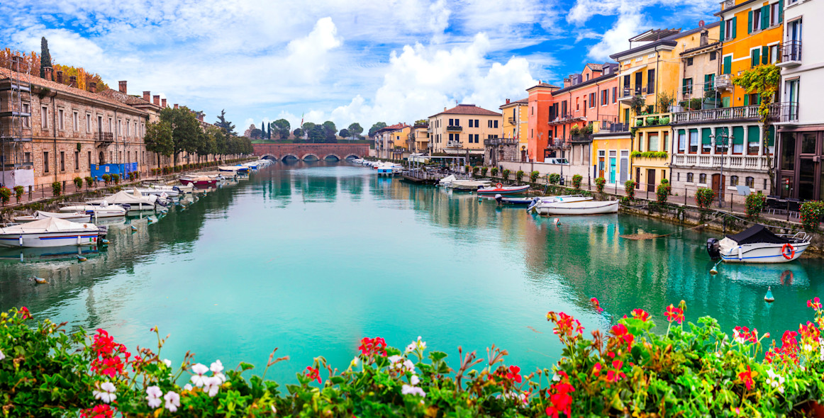 The pier in Peschiera del Garda with several boats moored there