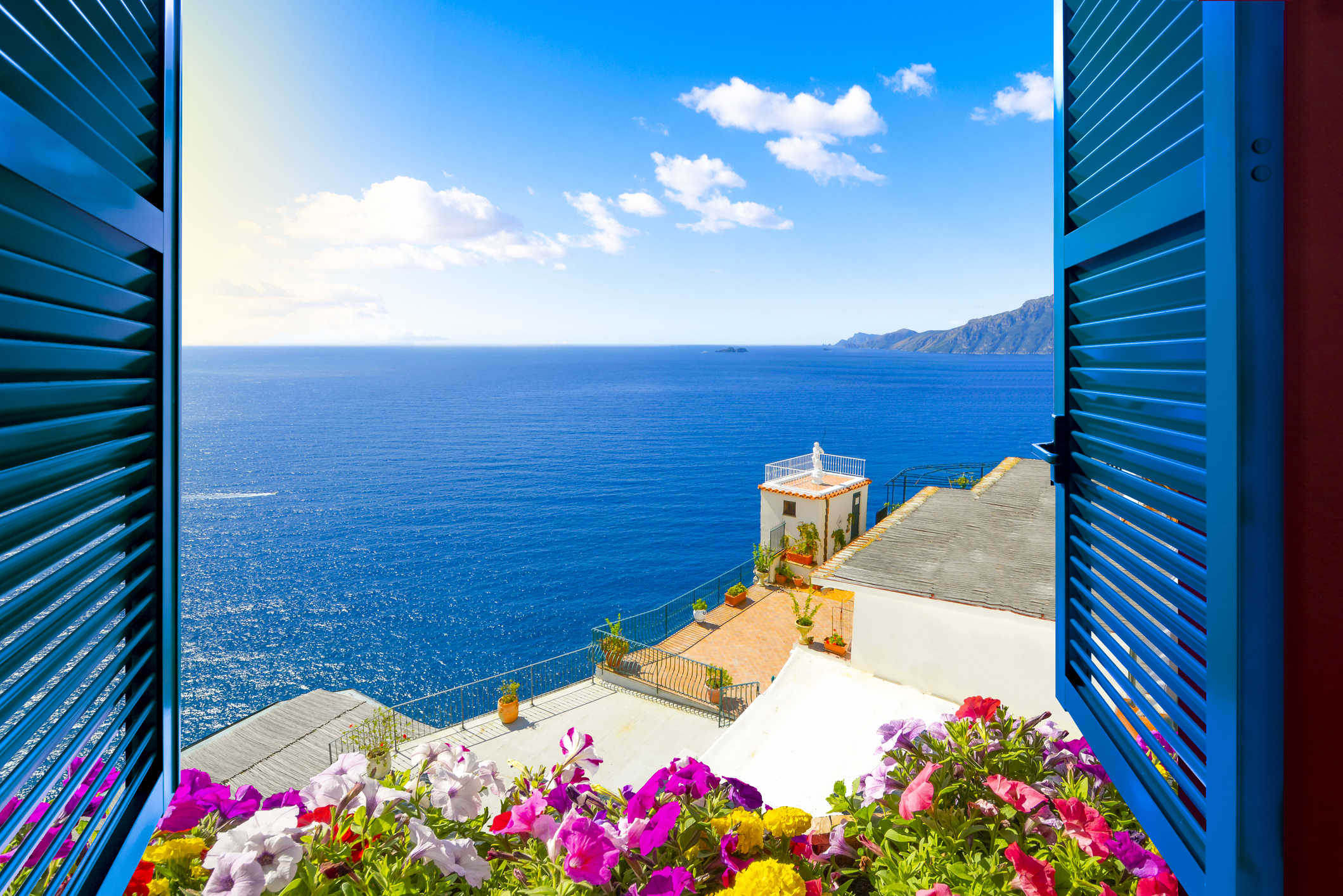 The view of the sea from the window of a home in southern Italy