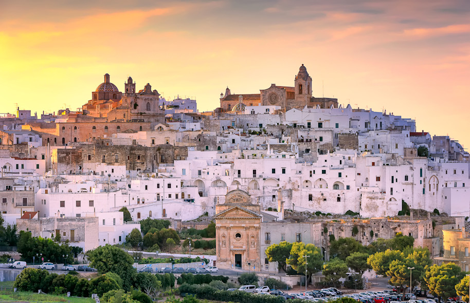 The town of Ostuni seen at sunset from the surrounding countryside