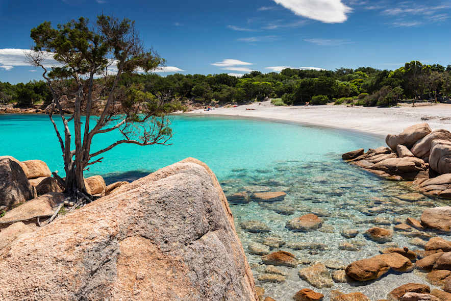 Cliffs and crystal clear sea of a small beach in Costa Smeralda