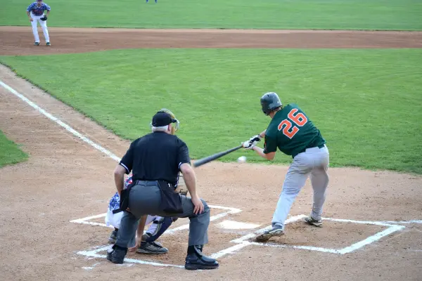 baseball batter hitting the ball