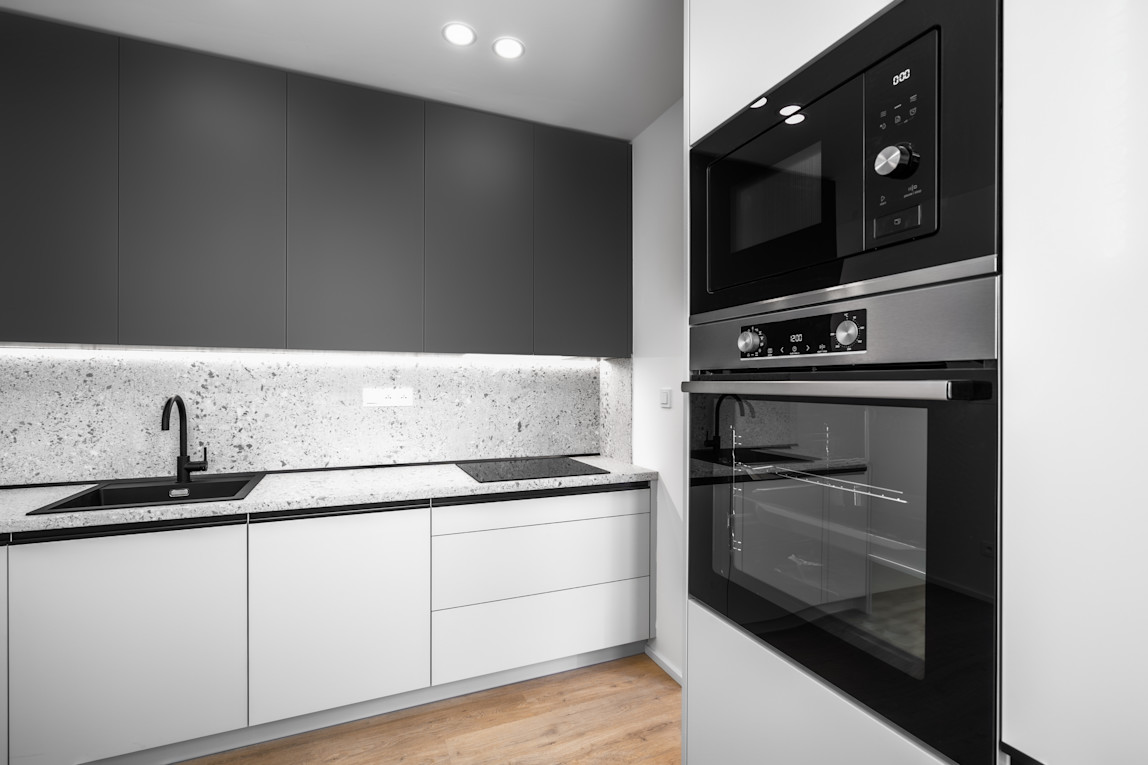 Sleek modern kitchen with a built-in microwave oven