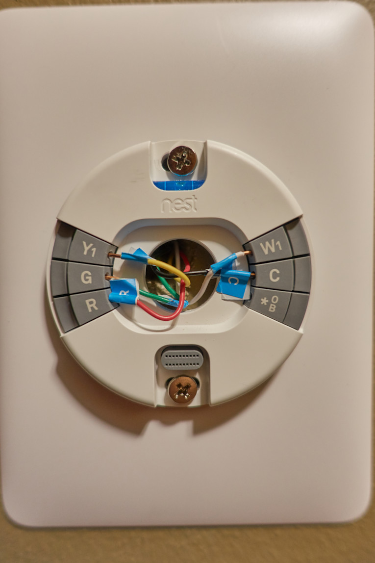 The wiring system inside a smart thermostat, the c-wire displayed