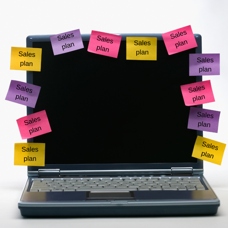 sales plan sticky notes on a laptop