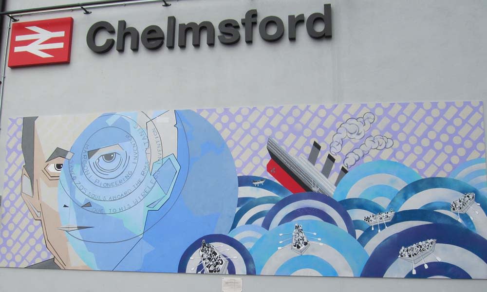 Mural of mans face and ship at sea at Chelmsford railway station